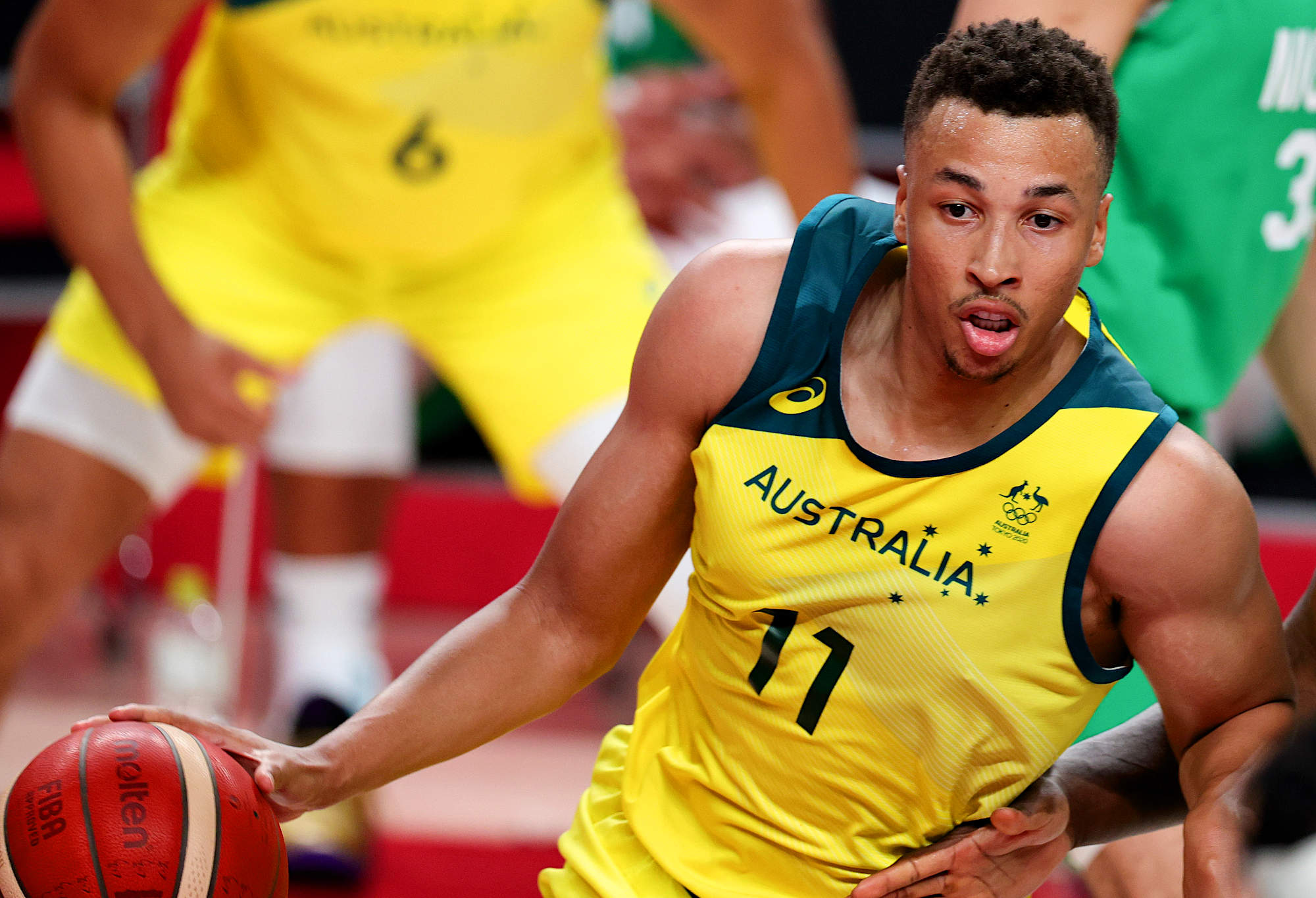 Dante Exum of the Australian Boomers dribbles the basketball