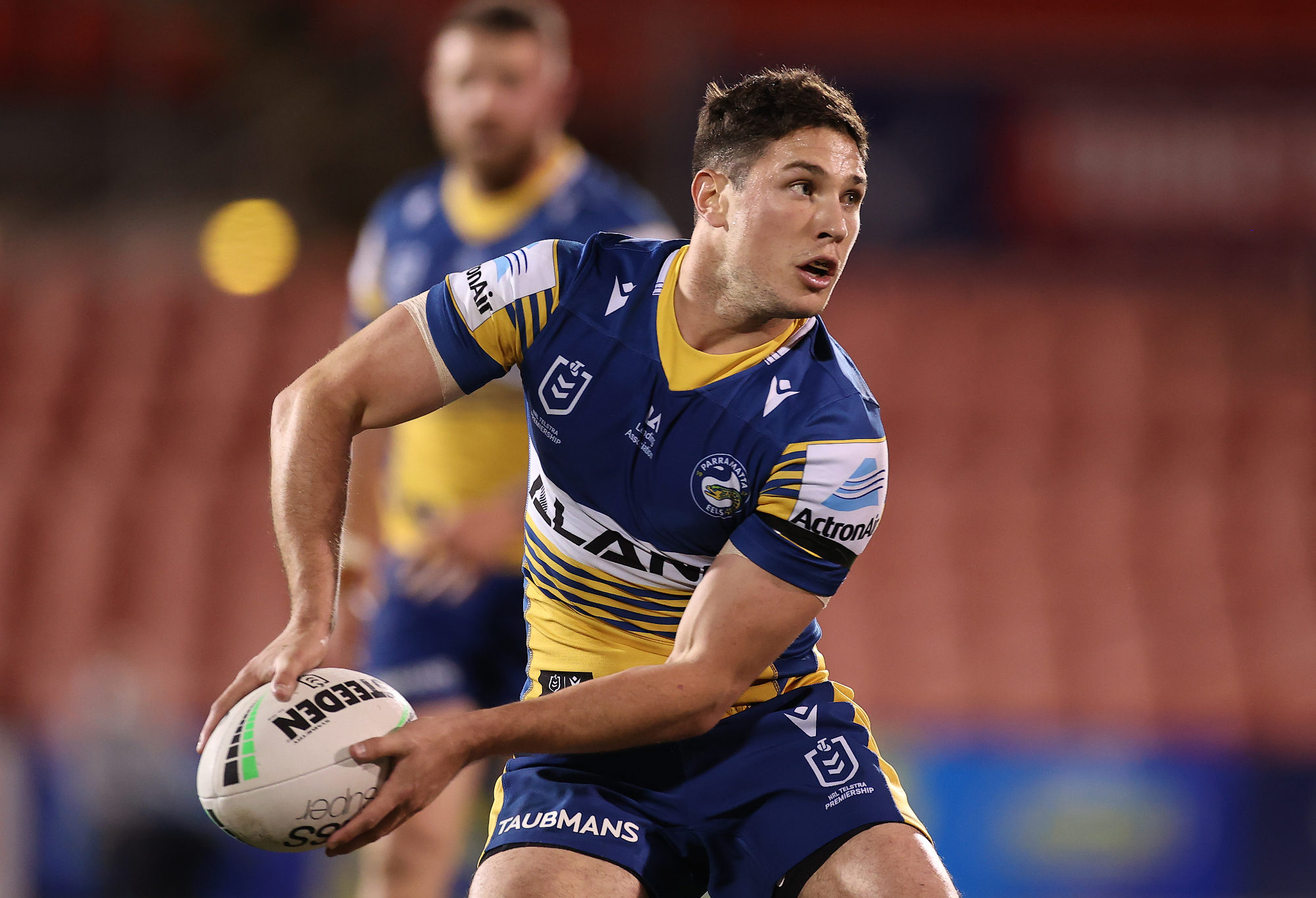 Mitchell Moses offloads the ball.