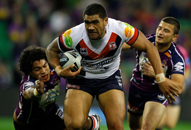 Mose Masoe breaks a tackle while playing for the Roosters