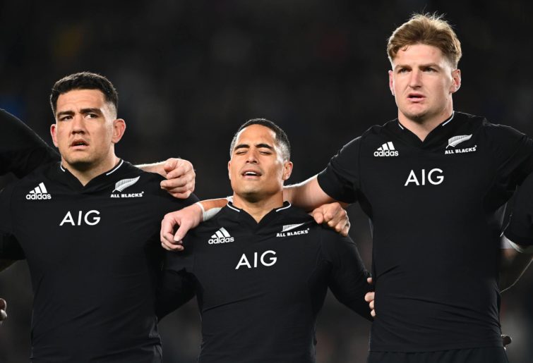 Codie Taylor, Aaron Smith and Jordie Barrett sing the New Zealand anthem