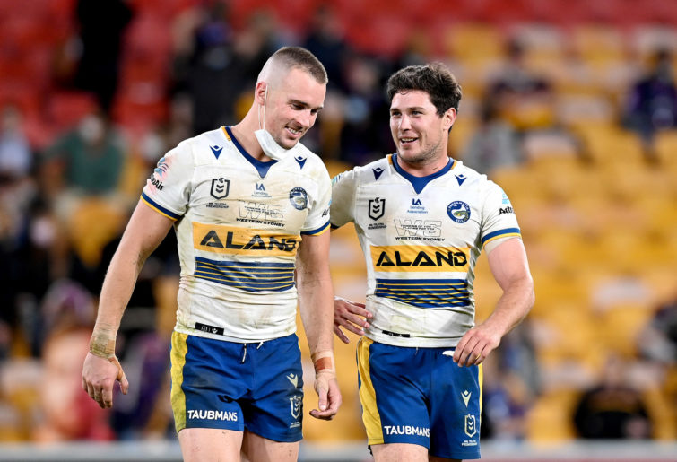Clint Gutherson and Mitchell Moses enjoy their victory over the Storm.