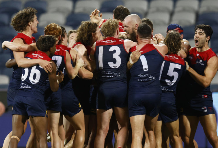 The Demons mob Max Gawn after kicking a goal after the siren to win the game against Geelong.