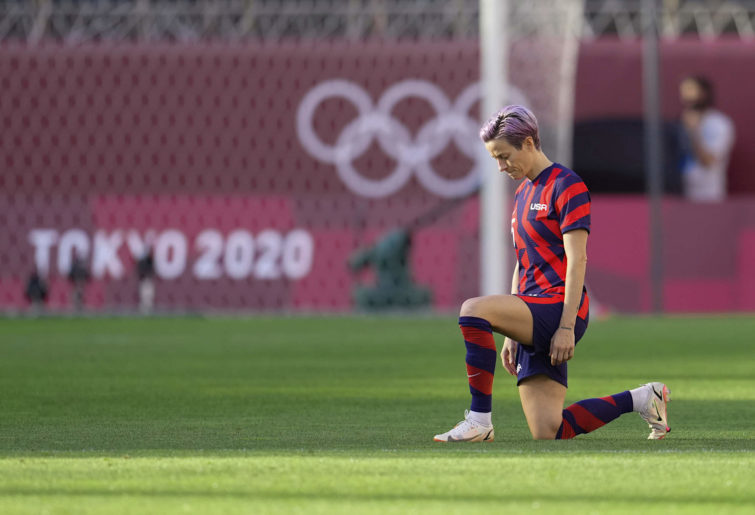 Megan Rapinoe kneels before the bronze medal Olympic football match