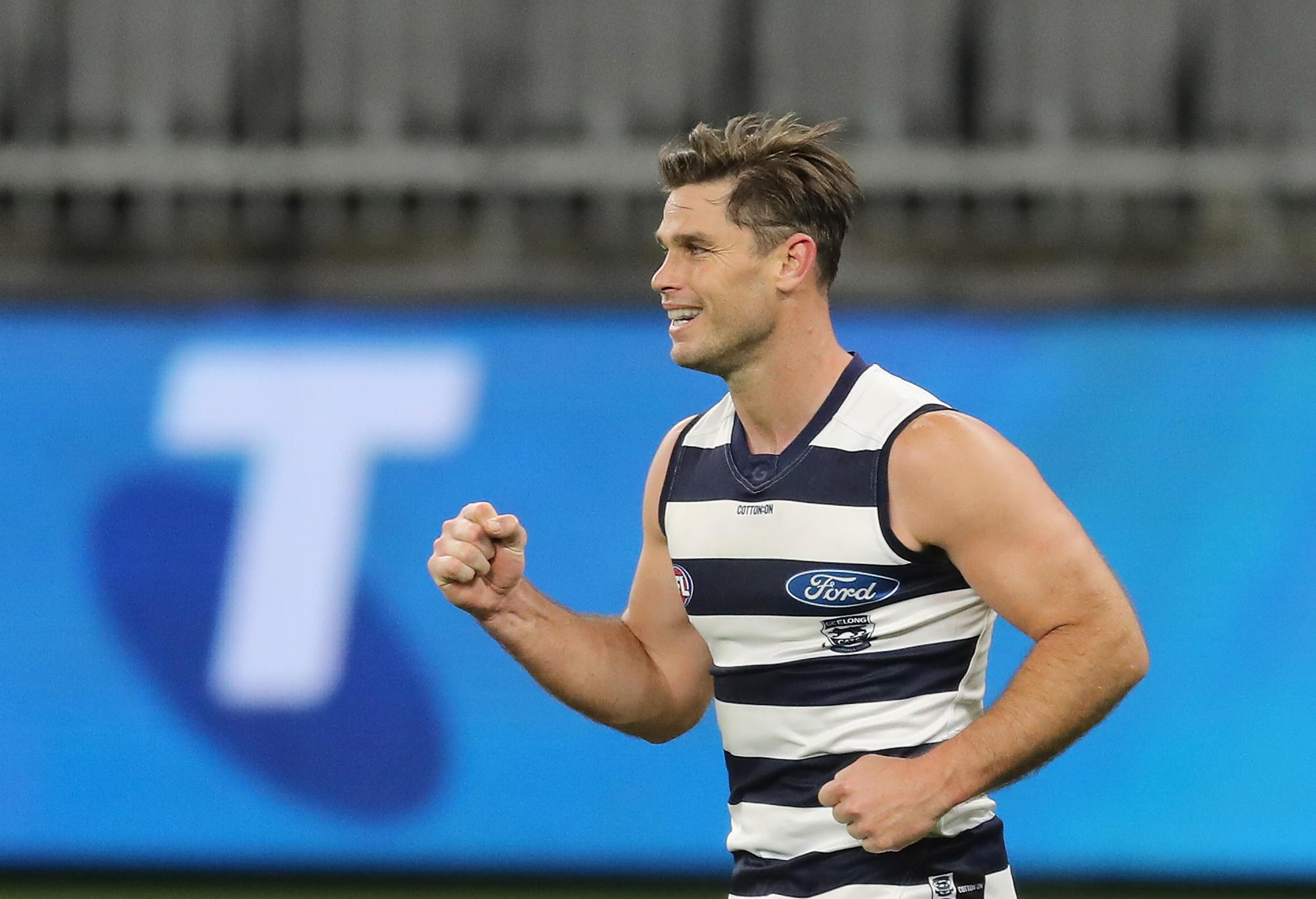 Tom Hawkins of the Cats celebrates after scoring a goal