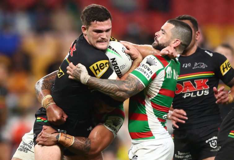 Nathan Cleary of the Panthers is tackled by Adam Reynolds of the Rabbitohs