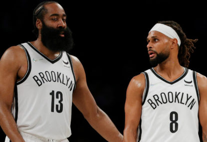 James Harden #13 talks with Patty Mills #8 of the Brooklyn Nets