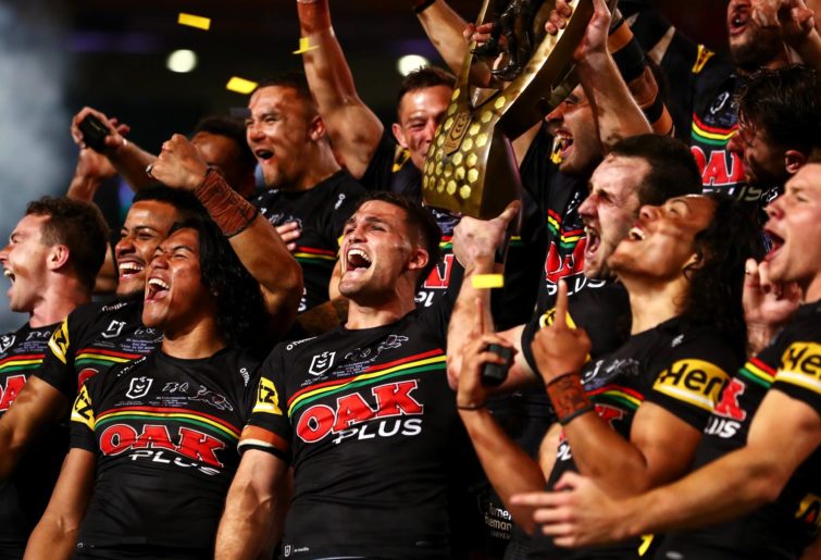 The Panthers celebrate with the NRL Premiership Trophy