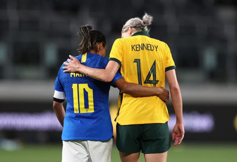 Alanna Kennedy of the Matildas and Marta Vieira Da Silva of Brazil embrace