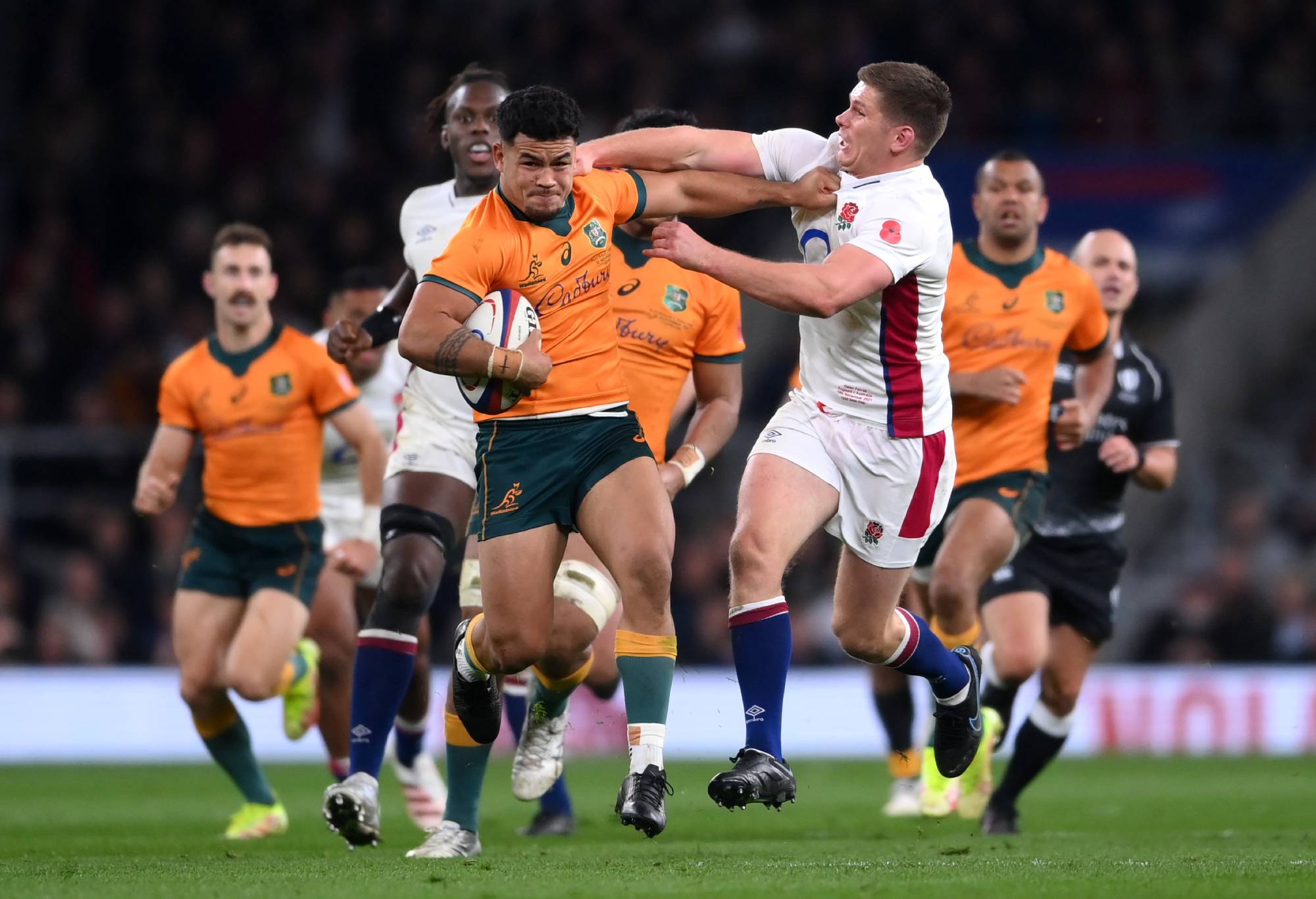 Hunter Paisami of Australia is tackled by Owen Farrell of England during the Autumn Nations Series match between England and Australia at Twickenham Stadium on November 13, 2021 in London, England. (Photo by Laurence Griffiths/Getty Images)