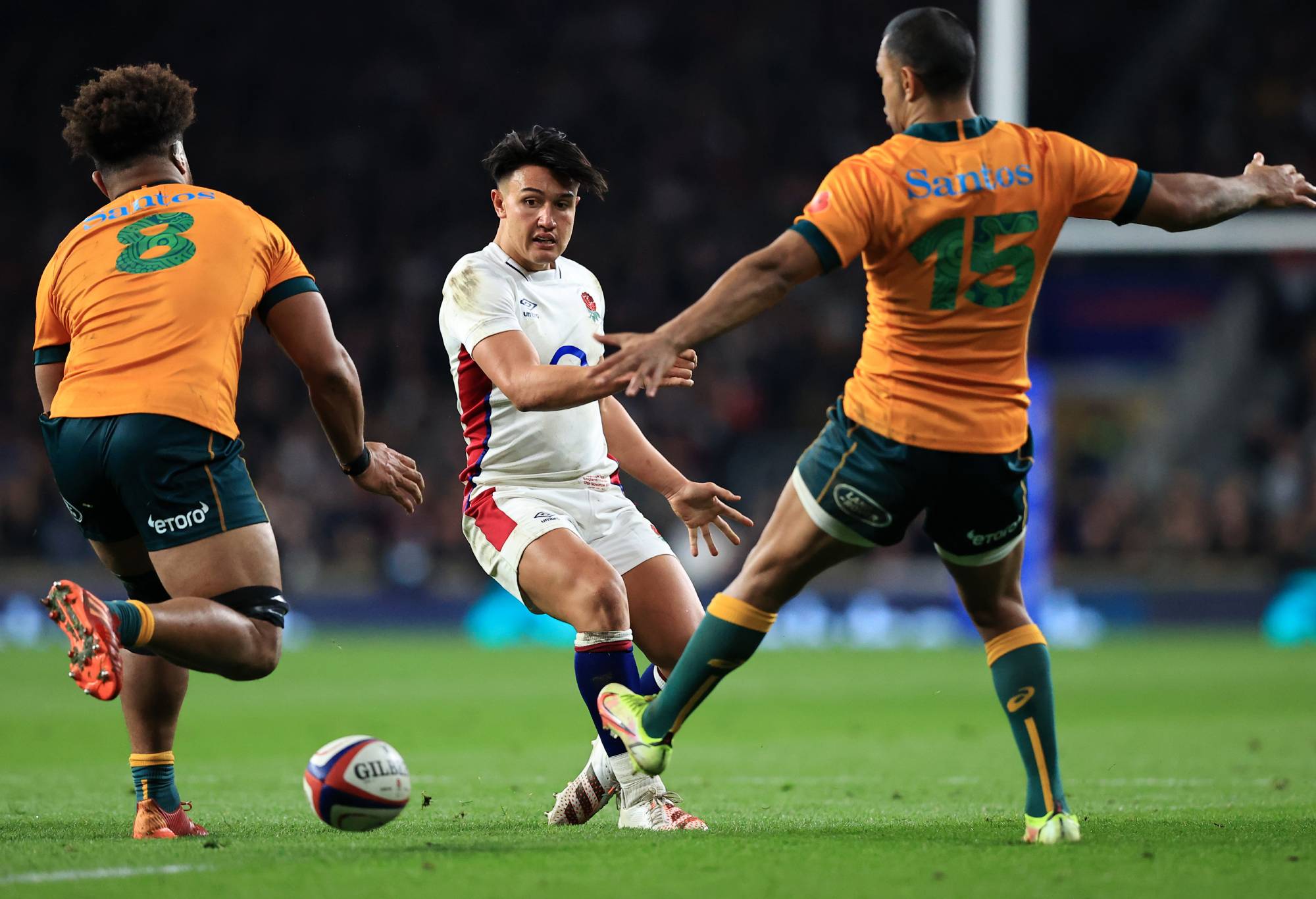 Marcus Smith of England kicks past Rob Valetini and Kurtley Beale of Australia during the Autumn Nations Series match between England and Australia at Twickenham Stadium on November 13, 2021 in London, England. (Photo by David Rogers/Getty Images)