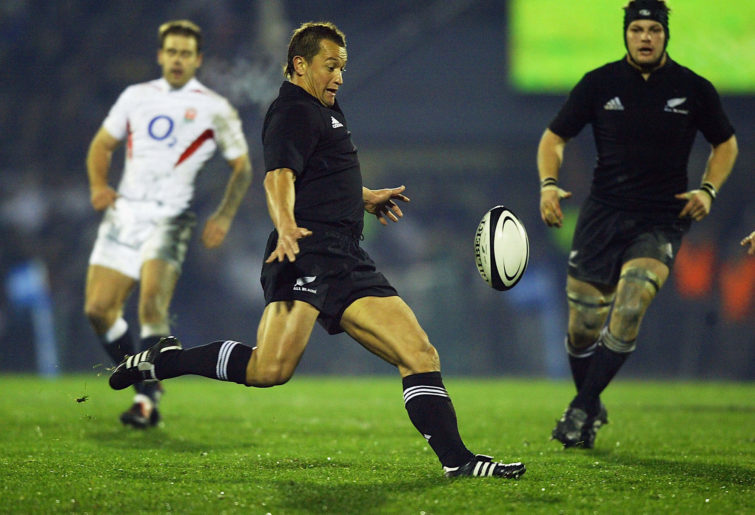 Carlos Spencer, the New Zealand scrumhalf, kicks the ball upfield during the New Zealand v England rugby union international at Carisbrook Stadium on June 12, 2004