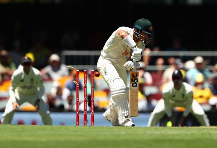 David Warner of Australia is bowled by Ben Stokes of England prior to it being ruled a no ball during day two of the First Test Match in the Ashes series between Australia and England at The Gabba on December 09, 2021 in Brisbane, Australia. (Photo by Chris Hyde/Getty Images)