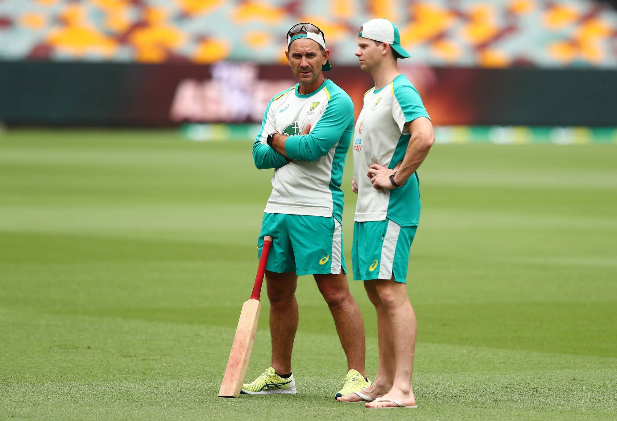 Head coach Justin Langer and Steve Smith talk during an Australian Ashes squad nets session at The Gabba on December 07, 2021 in Brisbane, Australia. (Photo by Chris Hyde/Getty Images)