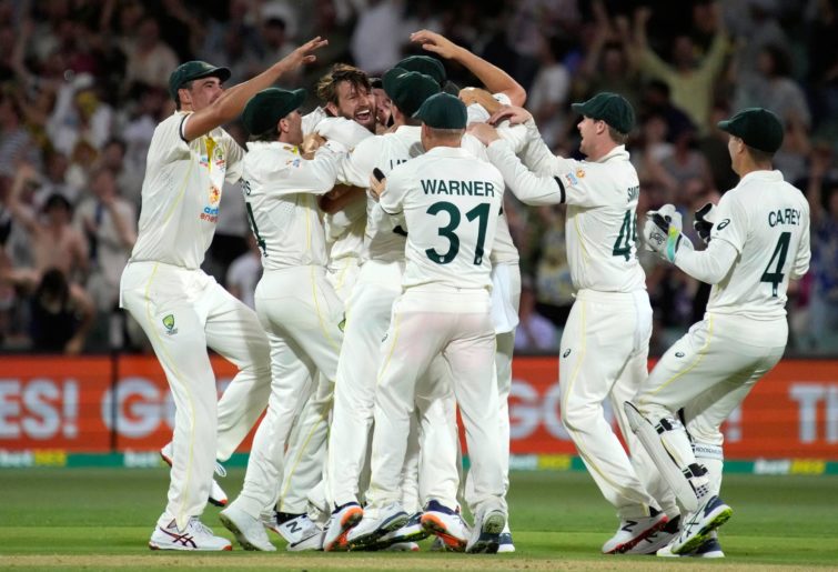 Michael Neser of Australia celebrates with team mates after taking the wicket of Haseeb Hameed of England for 6 runs during day two of the Second Test match in the Ashes series between Australia and England at the Adelaide Oval on December 17, 2021 in Adelaide, Australia. (Photo by Daniel Kalisz/Getty Images)