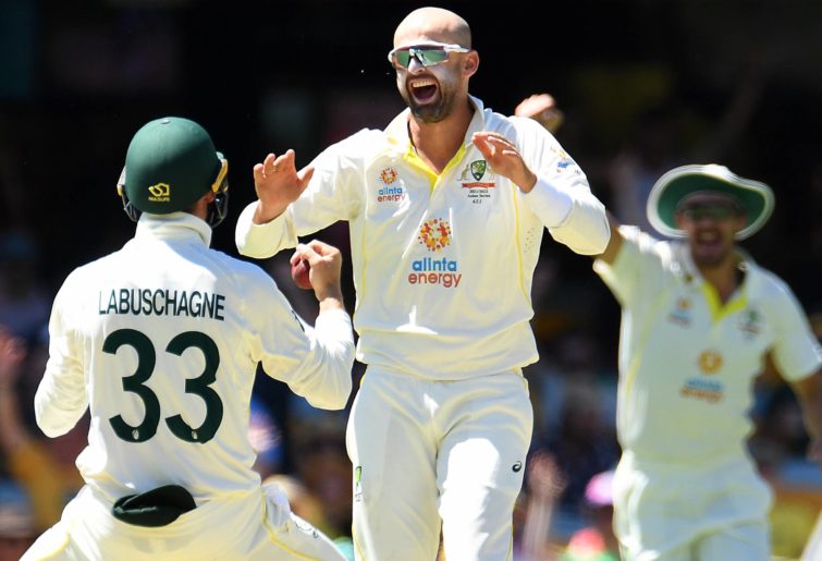 Nathan Lyon of Australia celebrates the dismissal of Dawid Malan of England during day four of the Ashes Series 1 Test match between Australia and England at The Gabba on December 11, 2021 in Brisbane, Australia.  (Photo by Albert Perez - CA/Cricket Australia via Getty Images