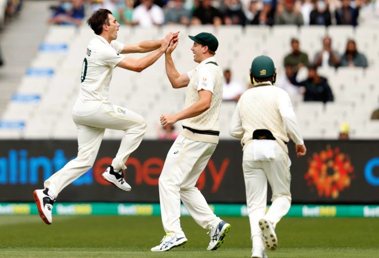 Pat Cummins of Australia celebrates the wicket of Haseeb Hameed of England during day one of the Third Test match in the Ashes series between Australia and England at Melbourne Cricket Ground on December 26, 2021 in Melbourne, Australia. (Photo by Darrian Traynor - CA/Cricket Australia via Getty Images)