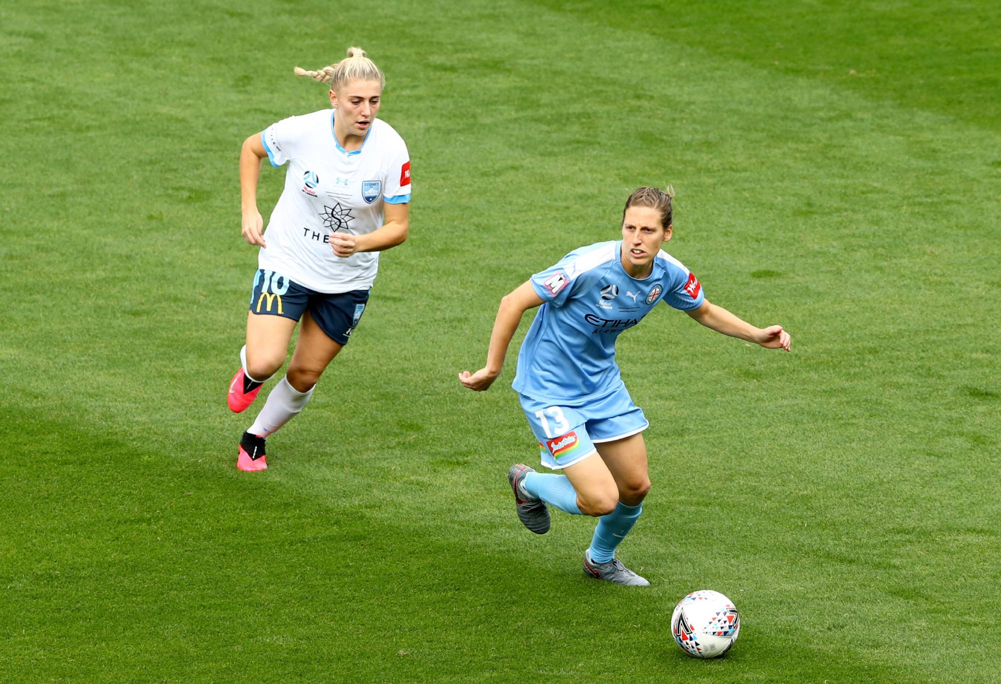 Rebekah Stott of Melbourne City makes a break away from Remy Siemsen of Sydney FC during the 2020 W-League Grand Final match between Melbourne City and Sydney FC at AAMI Park on March 21, 2020 in Melbourne, Australia. (Photo by Robert Cianflone/Getty Images)