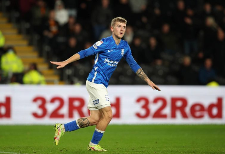 Riley Mcgree of Birmingham City urges the away supporters to stop throwing bottles onto the pitch during the Sky Bet Championship match between Hull City and Birmingham City at MKM Stadium on November 20, 2021 in Hull, England. (Photo by Ashley Allen/Getty Images)