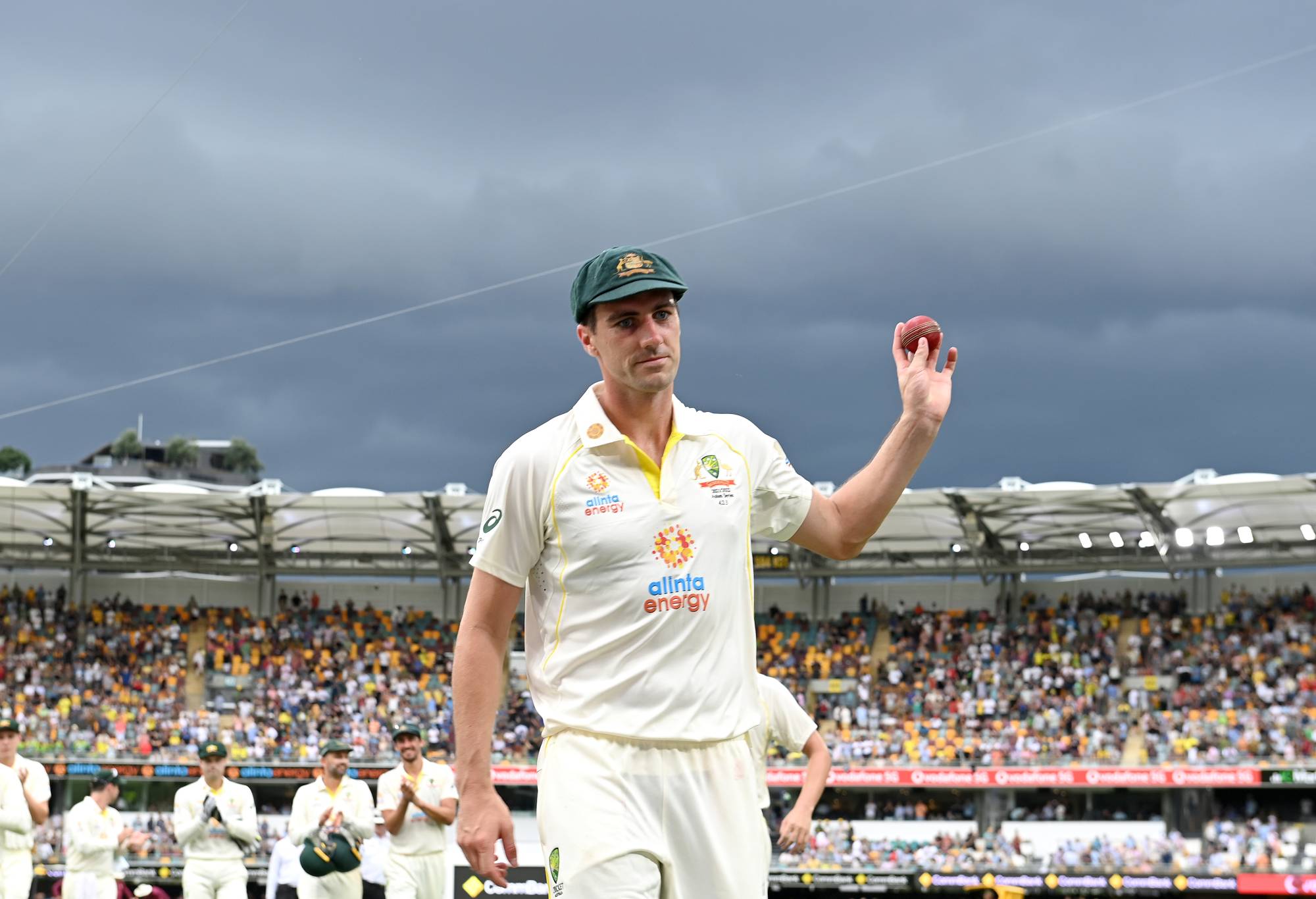Pat Cummins of Australia holds up the ball after taking five wickets in an innings during day one of the First Test Match in the Ashes series between Australia and England at The Gabba on December 08, 2021 in Brisbane, Australia. (Photo by Bradley Kanaris/Getty Images)