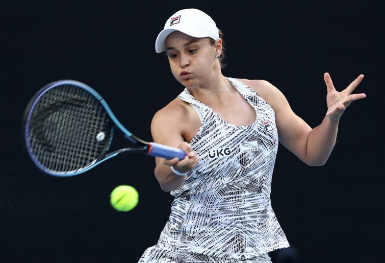 Ashleigh Barty of Australia plays a forehand in her first round singles match against Lesia Tsurenko of Ukraine during day one of the 2022 Australian Open at Melbourne Park on January 17, 2022 in Melbourne, Australia. (Photo by Cameron Spencer/Getty Images)