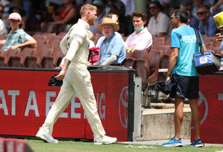 Ben Stokes leaves the ground with an injury.