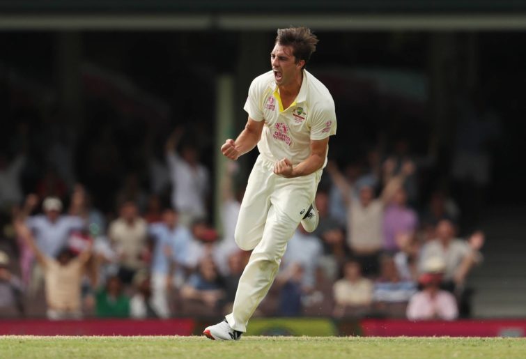 : Pat Cummins of Australia celebrates taking the wicket of Mark Wood of England during day five of the Fourth Test Match in the Ashes series between Australia and England at Sydney Cricket Ground on January 09, 2022 in Sydney, Australia. (Photo by Mark Metcalfe - CA/Cricket Australia via Getty Images)