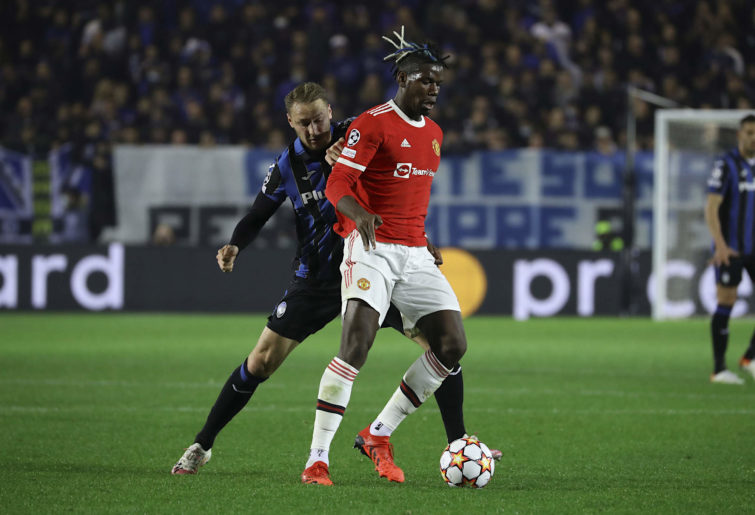 Paul Pogba holds off a defender