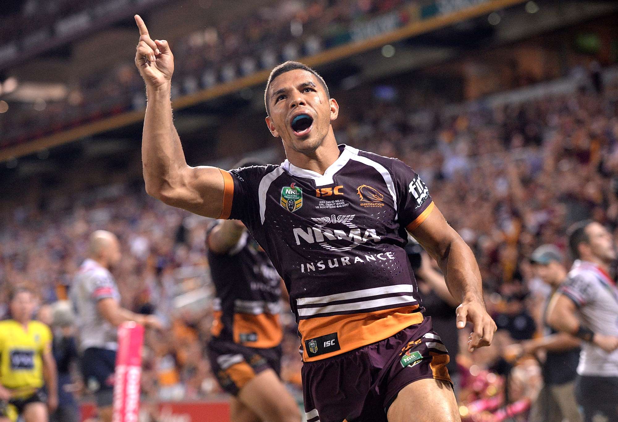 David Mead of the Broncos celebrates scoring a try