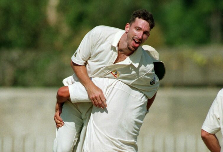 RAWALPINDI - 9 OCTOBER: Damien Fleming of Australia celebrates his hat-trick after taking the wicket of Saleem Malik of Pakistan during the 2nd Test Match at the Rawalpindi Cricket Stadium in Rawalpindi, Pakistan on October 9, 1994. Fleming became only the third bowler to get a hat-trick in his debut test. (photo by Shaun Botterill/Getty Images)
