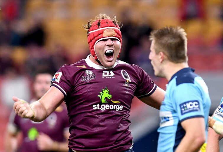 Harry Wilson of the Reds celebrates scoring a try during the round 1 Super Rugby AU match between the Queensland Reds and the New South Wales Waratahs at Suncorp Stadium on July 03, 2020 in Brisbane, Australia. (Photo by Bradley Kanaris/Getty Images)