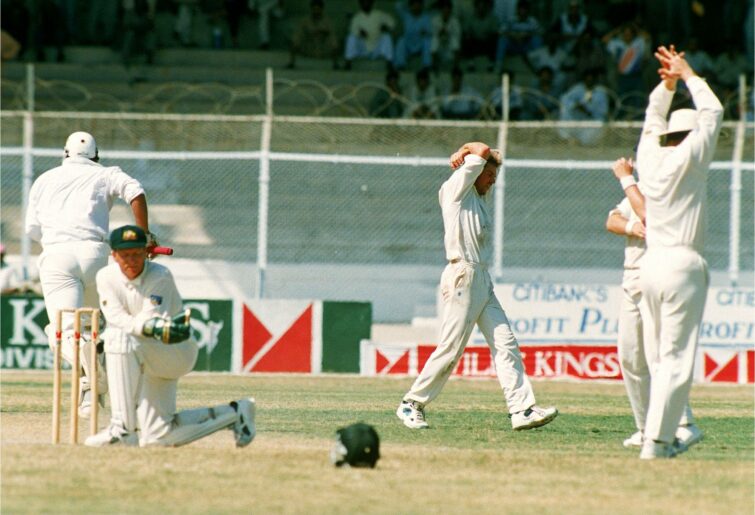 KARACHI, PAKISTAN - OCTOBER 2: Shane Warne of Australia shows his frustration as the ball runs for 4 byes to give Pakistan victory during the 1st Test match between Pakistan and Australia October 2, 1994 in Karachi, Pakistan. (Photo by Shaun Botterill/Getty Images)