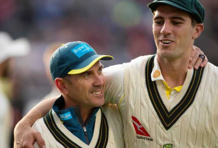 Australia Coach Justin Langer celebrates with bowler Pat Cummins during day five of the 4th Ashes Test Match between England and Australia at Old Trafford on September 08, 2019 in Manchester, England. (Photo by Visionhaus)
