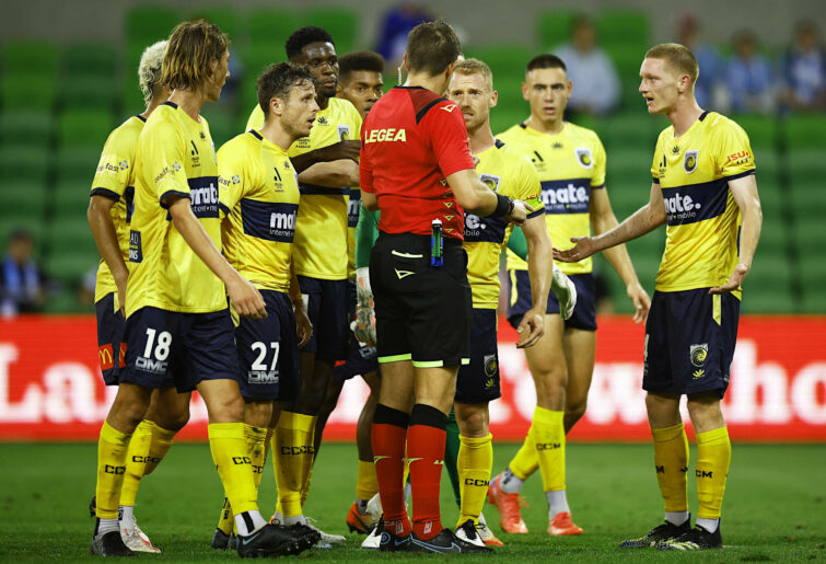 Mariners players protest referee Shaun Evans' decision
