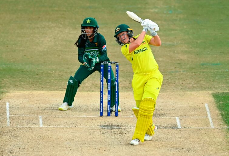 Alyssa Healy of Australia bats while Sidra Nawaz of Pakistan loduring the 2022 ICC Women's Cricket World Cup match between Australia and Pakistan at Bay Oval on March 08, 2022 in Tauranga, New Zealand. (Photo by Hannah Peters-ICC/ICC via Getty Images)