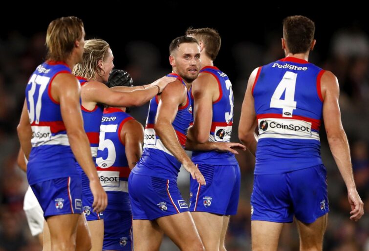 MELBOURNE, AUSTRALIA - MARCH 04: Hayden Crozier of the Bulldogs celebrates a goal with teammates during the 2022 AFL Community Series match between the Western Bulldogs and the Brisbane Lions at Marvel Stadium on March 4, 2022 In Melbourne, Australia. (Photo by Dylan Burns/AFL Photos via Getty Images)