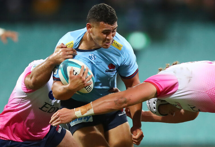 Izaia Perese of the Waratahs is tackled.