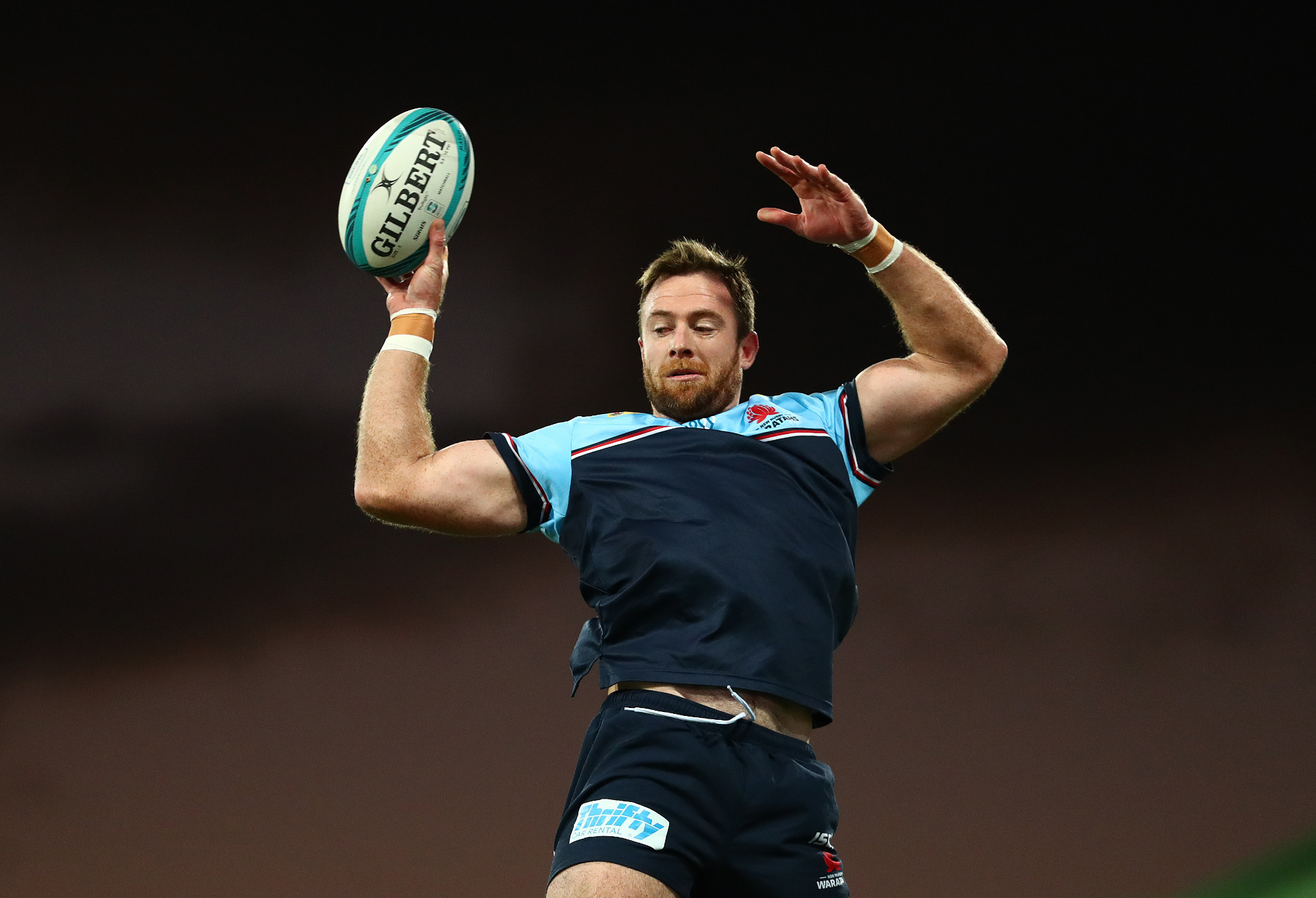 Jed Holloway of the Waratahs takes a lineout.