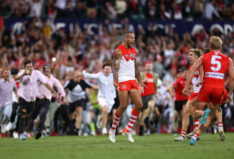 Lance Franklin of the Swans celebrates kicking his 1000th AFL goal.