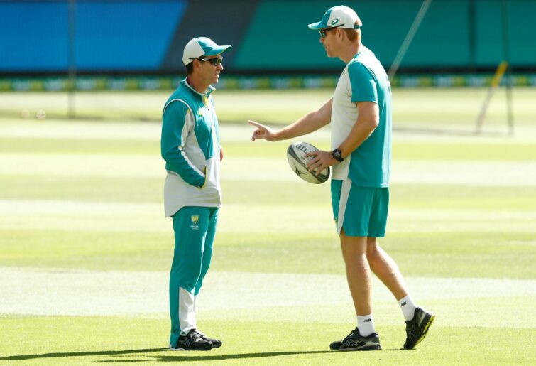 MELBOURNE, AUSTRALIA - DECEMBER 29: Australian Head Coach Justin Langer speaks with Assistant coach Andrew McDonald before day four of the Second Test match between Australia and India at Melbourne Cricket Ground on December 29, 2020 in Melbourne, Australia. (Photo by Darrian Traynor - CA/Cricket Australia via Getty Images)