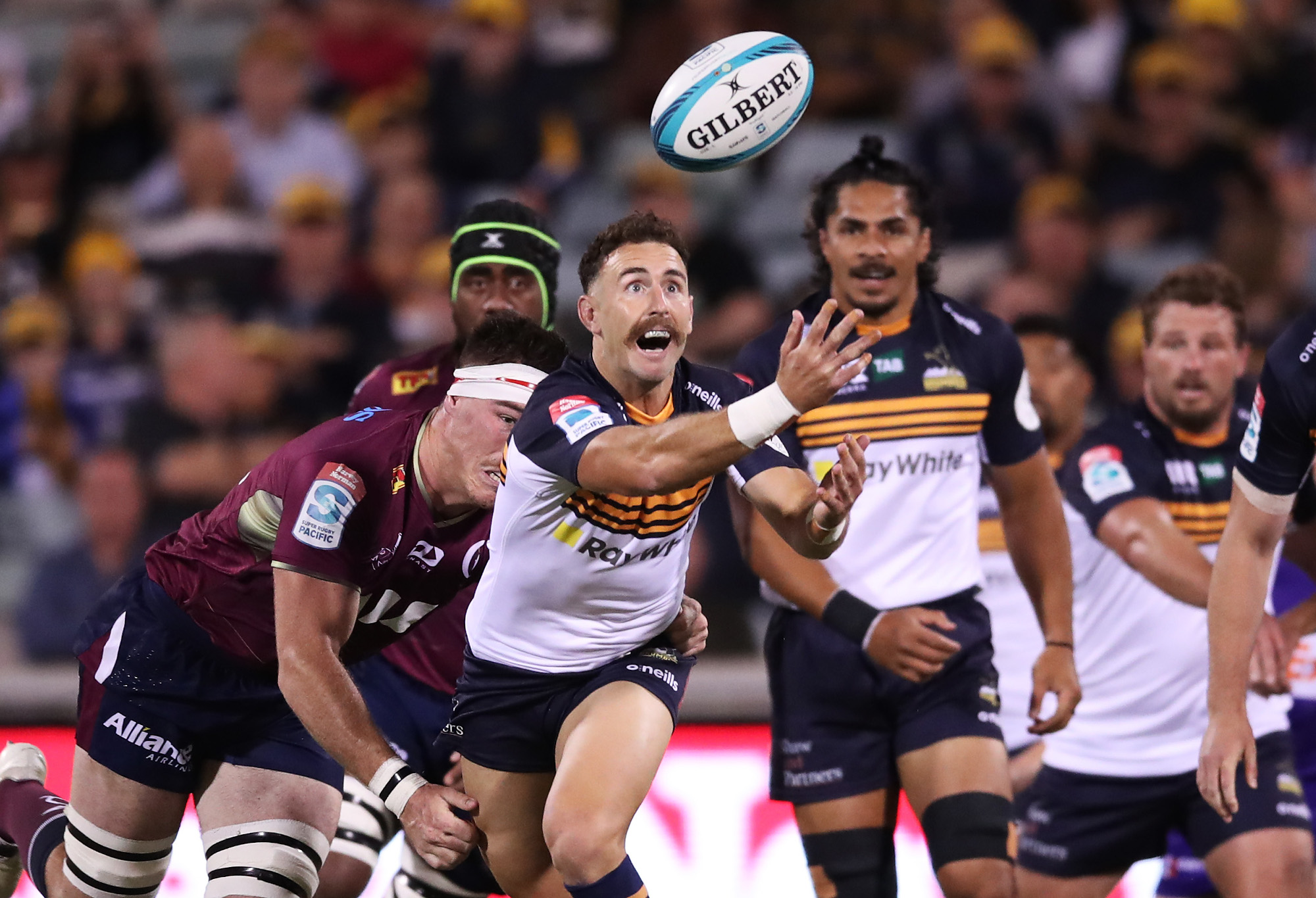 Nic White of the Brumbies juggles the ball.