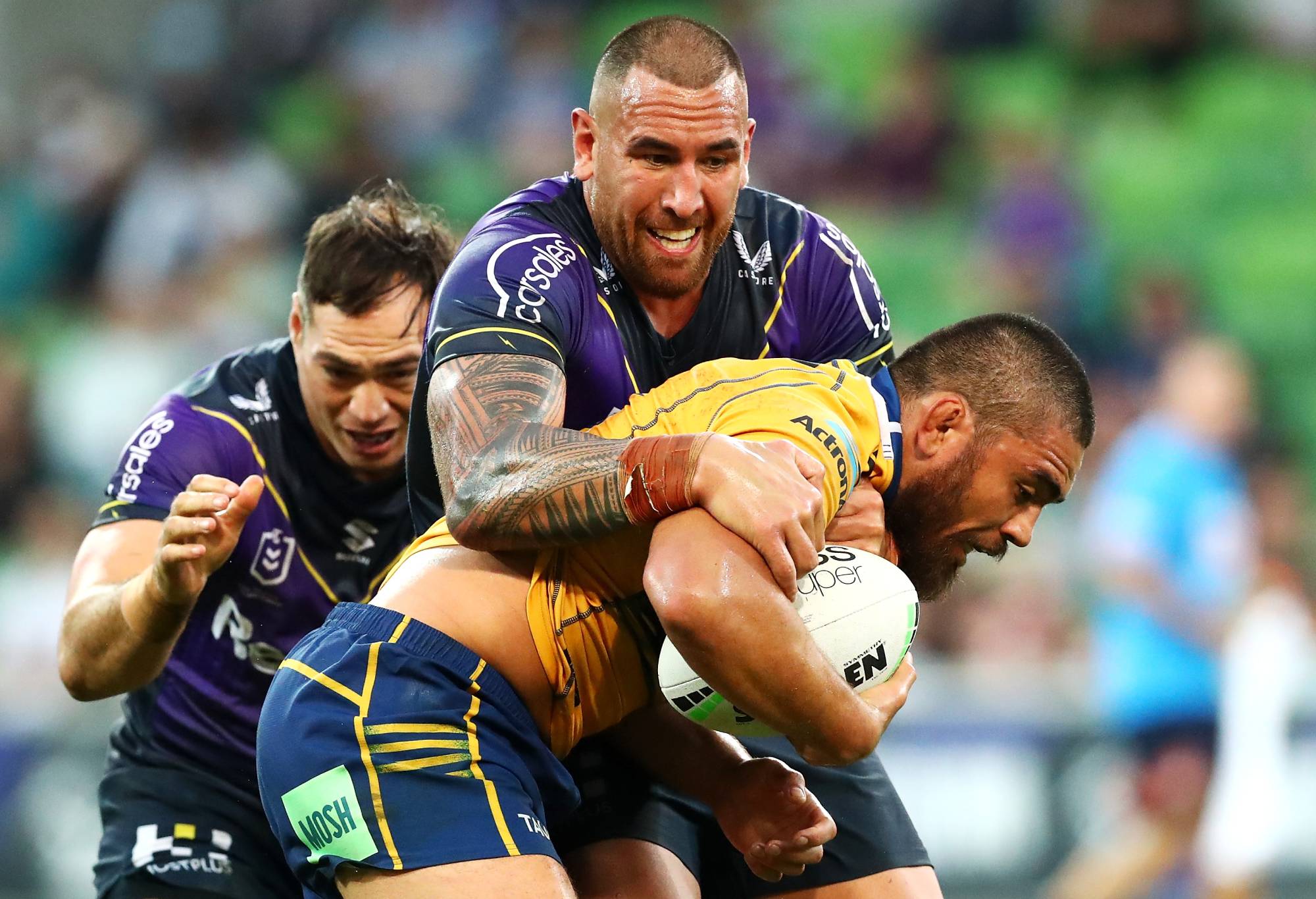 MELBOURNE, AUSTRALIA - MARCH 26: Nelson Asofa-Solomona of the Storm tackles Isaiah Papali'i of the Eels during the round three NRL match between the Melbourne Storm and the Parramatta Eels at AAMI Park, on March 26, 2022, in Melbourne, Australia. (Photo by Kelly Defina/Getty Images)