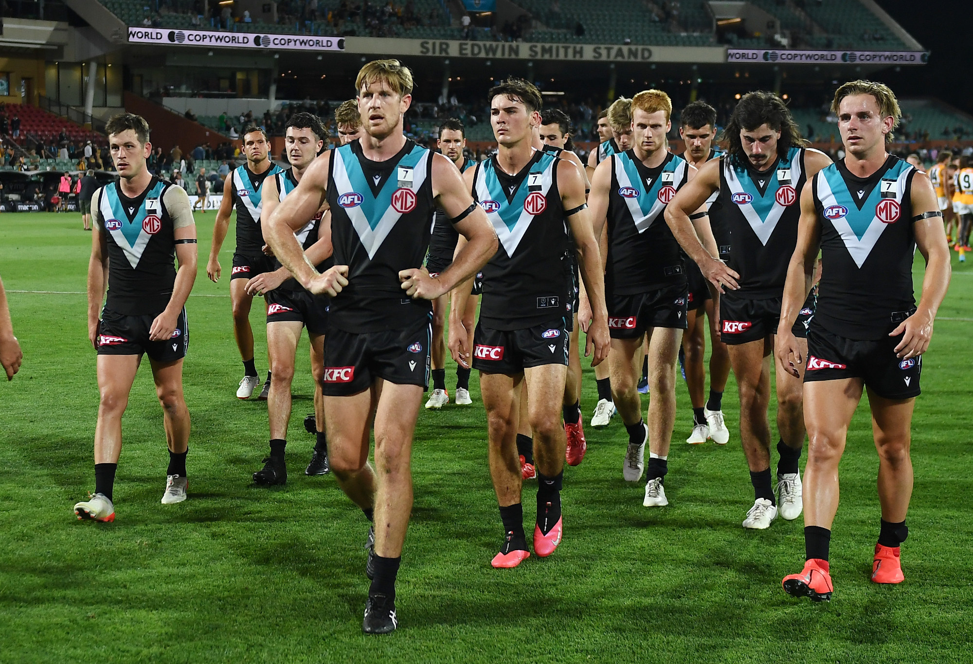 Tom Jonas of Port Adelaide leads his team off after their massive loss to Hawthorn.