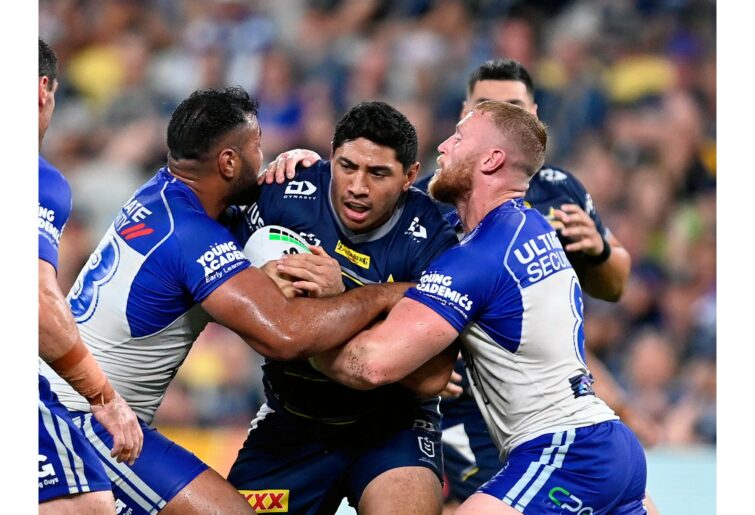 TOWNSVILLE, AUSTRALIA - MARCH 13: Jason Taumalolo of the Cowboys is tackled during the round one NRL match between the North Queensland Cowboys and the Canterbury Bulldogs at Qld Country Bank Stadium, on March 13, 2022, in Townsville, Australia. (Photo by Ian Hitchcock/Getty Images)