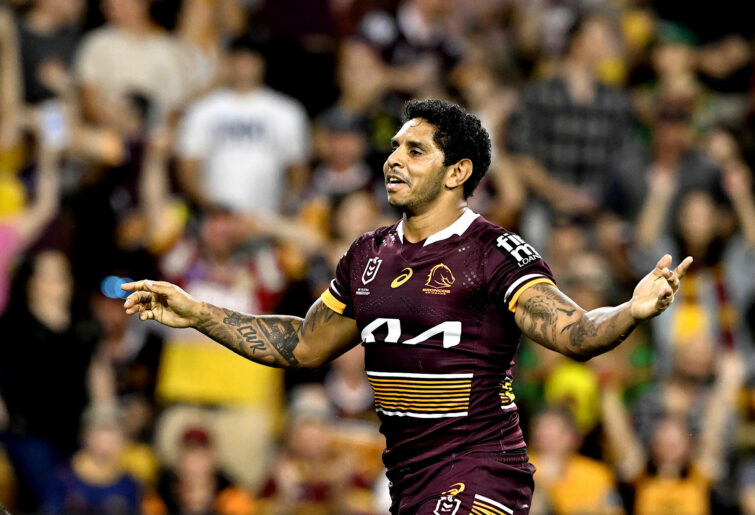 Albert Kelly of the Broncos celebrates scoring a try