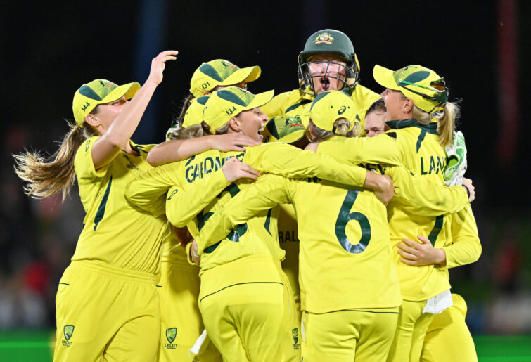 Australia celebrate winning the 2022 ICC Women's Cricket World Cup.
