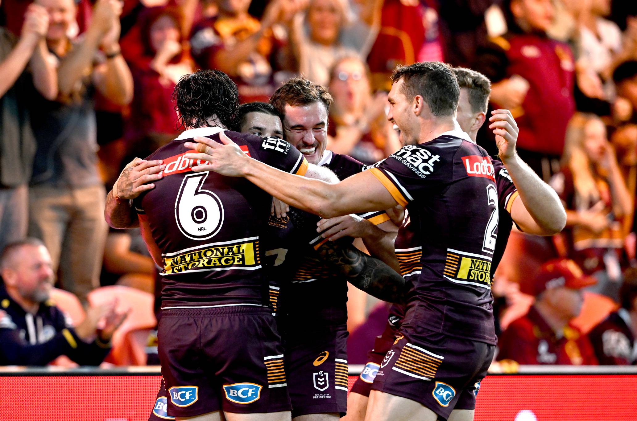 Adam Reynolds of the Broncos is congratulated by teammates