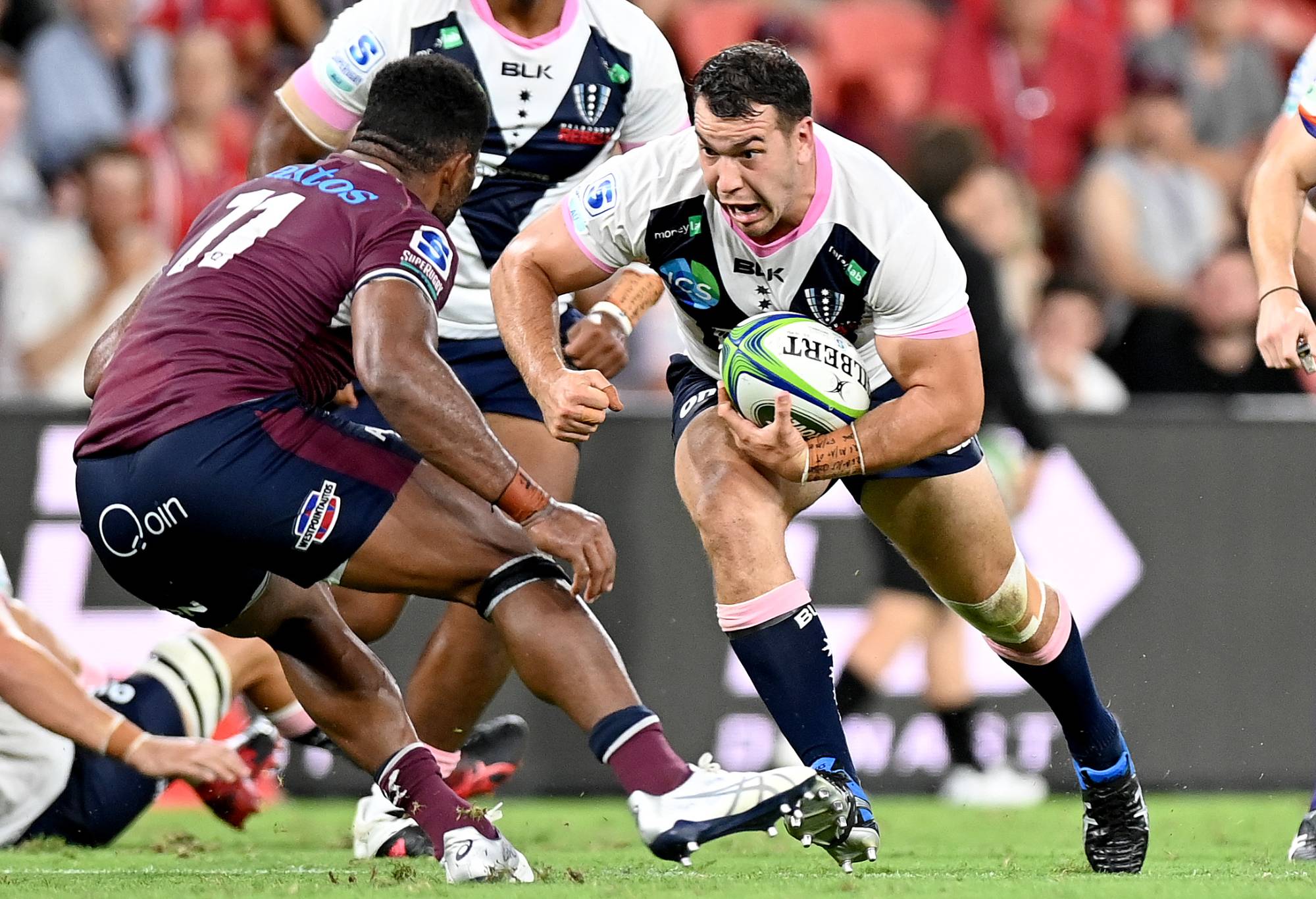 Ed Craig of the Melbourne Rebels takes on the defence during the round two Super Rugby AU match between the Melbourne Rebels and the Queensland Reds at Suncorp Stadium, on February 26, 2021, in Brisbane, Australia. (Photo by Bradley Kanaris/Getty Images