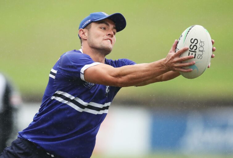 SYDNEY, AUSTRALIA – MARCH 16: Kyle Flanagan of the Bulldogs handles the ball during a Canterbury Bulldogs NRL training session at Belmore Sports Ground on March 16, 2022 in Sydney, Australia.  (Photo by Matt King/Getty Images)