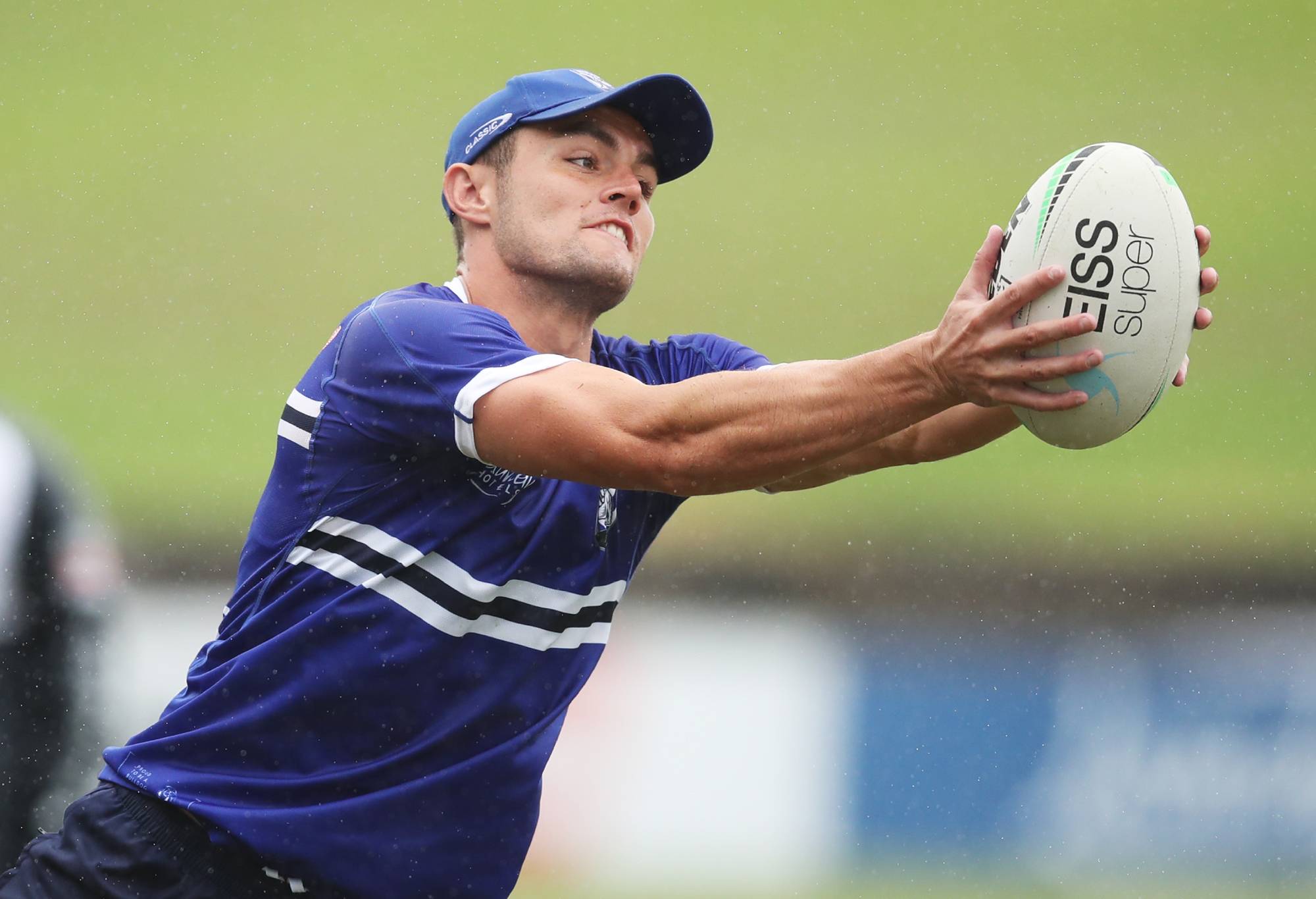 SYDNEY, AUSTRALIA - MARCH 16: Kyle Flanagan of the Bulldogs handles the ball during a Canterbury Bulldogs NRL training session at Belmore Sports Ground on March 16, 2022 in Sydney, Australia. (Photo by Matt King/Getty Images)