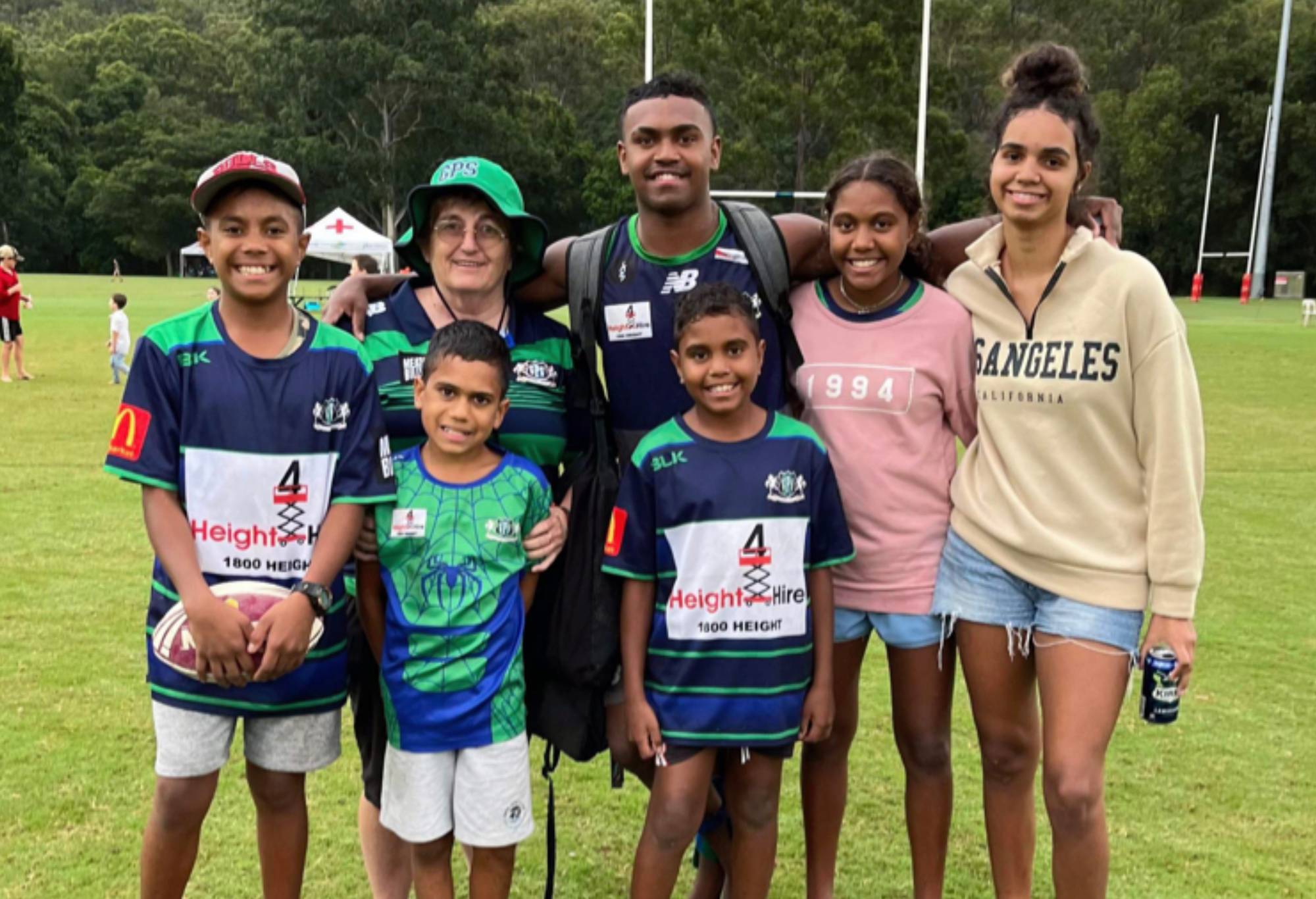 Reds rookie Floyd Aubrey (centre rear) with his mob (from left) Jaquon, mum Yvonne, Stephen, Derek, Harriet and Saffron at his GPS Rugby Club.